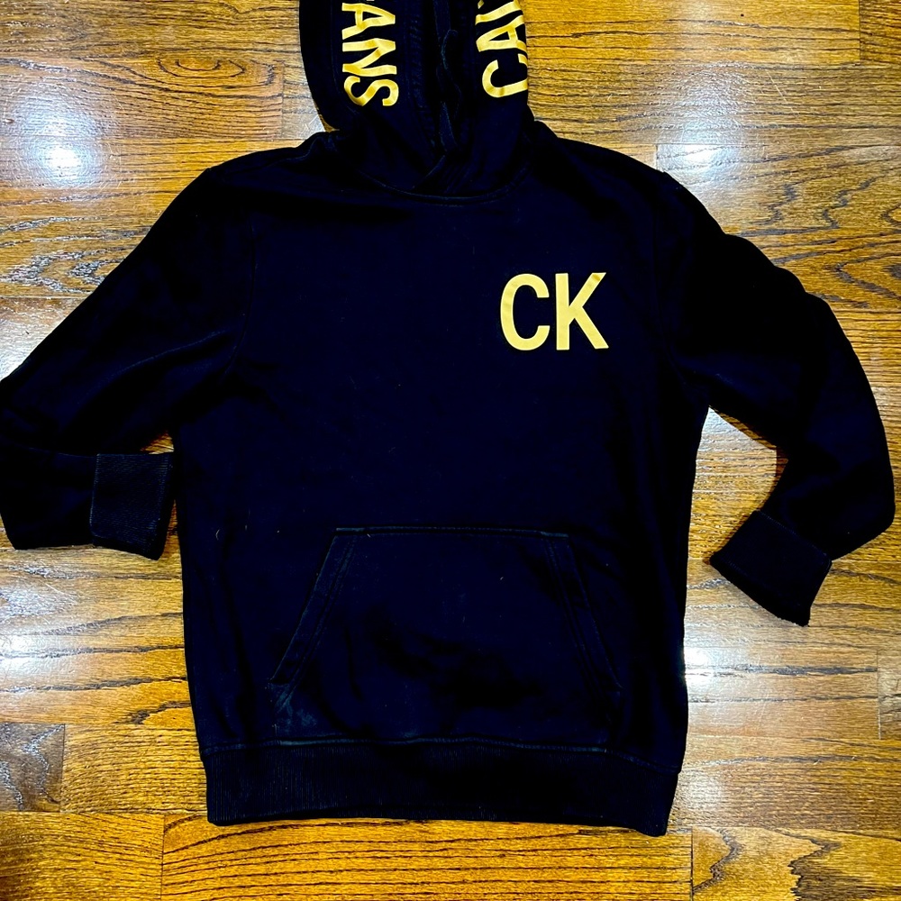 Calvin Klein women’s black hoodie with gold writing( medium)